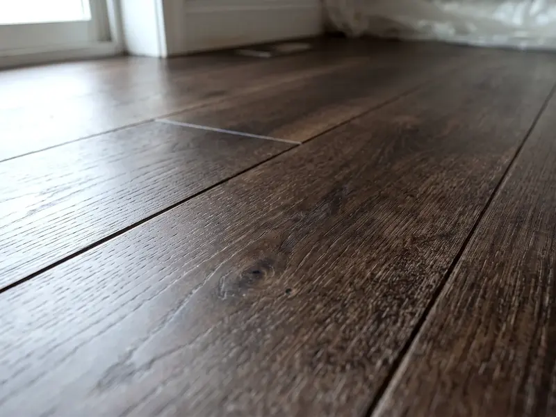 The same wood floor after post-construction cleaning, clear of dust and debris